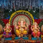 Decorated Lord Ganesha idols in festive pandal