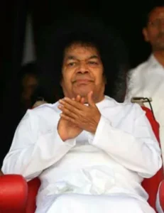Sri Sathya Sai Baba seated with folded hands, Veda Pushpanjali Part Second