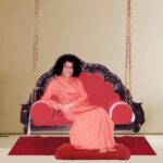 Sri Sathya Sai Baba seated peacefully on sacred swing