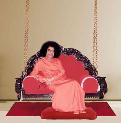 Sri Sathya Sai Baba seated peacefully on sacred swing