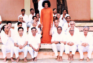 At his lotus feet