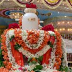 Decorated Shiva Lingam adorned with fresh flower garlands