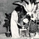 Sri Sathya Sai Baba lighting sacred lamp