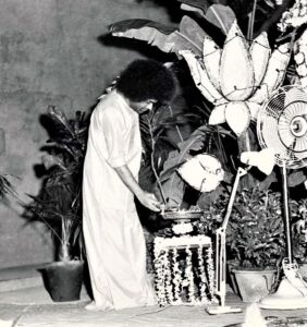 Sri Sathya Sai Baba lighting sacred lamp