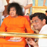 Bhagwan Shri Sathya Sai Baba with devoted disciple