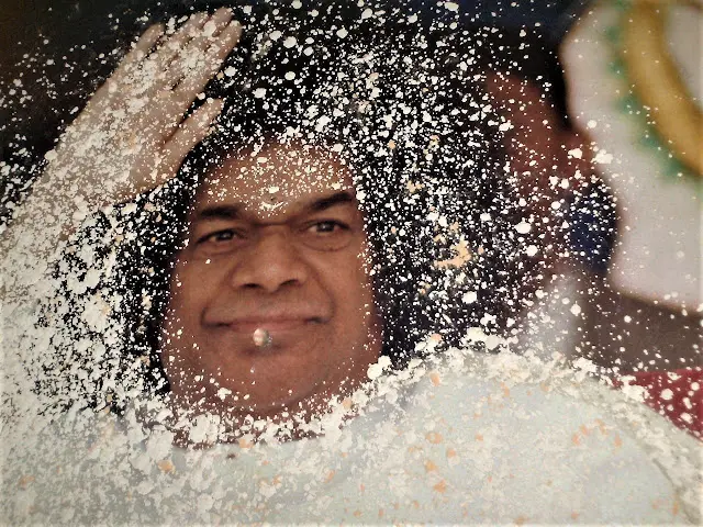 Bhagwan Shri Sathya Sai Baba manifesting sacred vibhuti