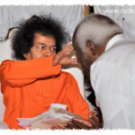 Shri Sathya Sai Baba blessing devotee picture