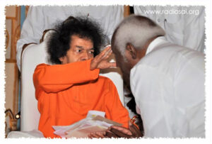Shri Sathya Sai Baba blessing devotee picture