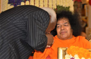 Shri Sathya Sai Baba blessing devotee picture