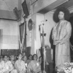 Bhagwan Shri Sathya Sai Baba addressing devotees indoors