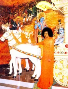 Sri Sathya Sai Baba before Lord Krishna chariot mural