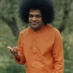 Sri Sathya Sai Baba offering divine blessings outdoors
