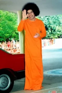 Sathya Sai Baba raising his hand