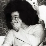 Sri Sathya Sai Baba laughing with divine joy