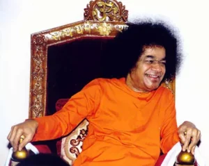 Bhagawan Sri Sathya Sai Baba smiling on throne
