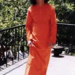 Sathya Sai Baba looking up smiling