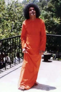 Sathya Sai Baba looking up smiling