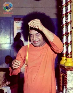 Bhagwan Shri Sathya Sai Baba holding sacred thread