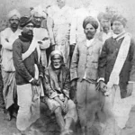 Shirdi Sai Baba with devotees in historic photograph