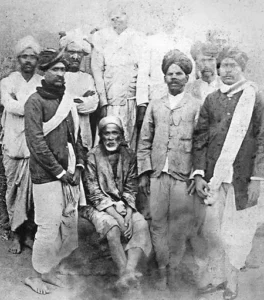 Shirdi Sai Baba with devotees in historic photograph