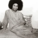 Rare Sri Sathya Sai Baba smiling seated portrait