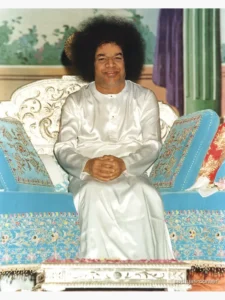 Bhagwan Shri Sathya Sai Baba seated smiling peacefully