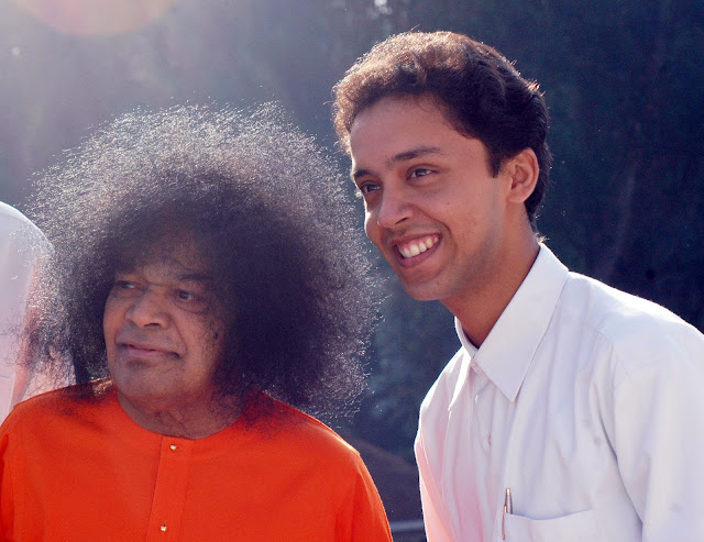 Shri Sathya Sai Baba with student picture