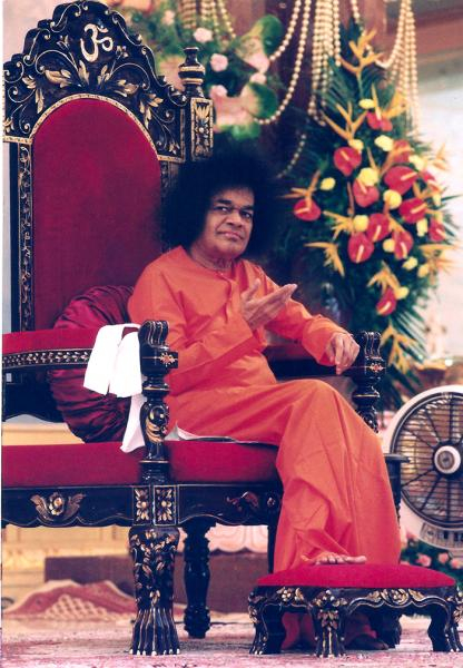 Sri Sathya Sai Baba seated gracefully on spiritual throne, Listen Shri Sathya Sai Baba Chinna Kathas