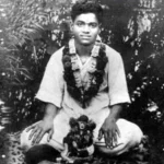 Young Sri Sathya Sai Baba with sacred flower garlands