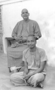 Swami Sivananda with disciple during spiritual guidance and meditation