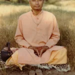 Sathya Sai devotee seated in meditation outdoors with peaceful expression