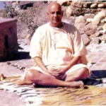 Swami Sivananda meditating in peaceful outdoor setting
