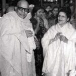 Swami Sivananda greeting devotee during spiritual gathering