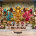 Pancha Tattva deities adorned with colorful flower garlands