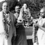 Swami Sivananda with disciples carrying sacred idol