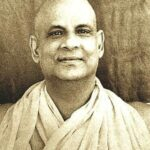 Swami Sivananda smiling with peaceful spiritual presence