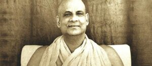 Swami Sivananda smiling with peaceful spiritual presence