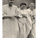 Swami Sivananda walking with devotees peacefully together
