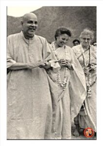 Swami Sivananda walking with devotees peacefully together