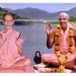 Two Hindu monks blessing beside sacred river
