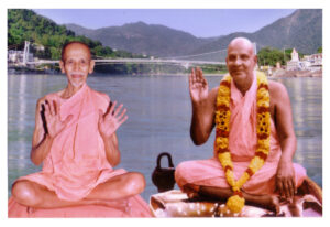 Two Hindu monks blessing beside sacred river
