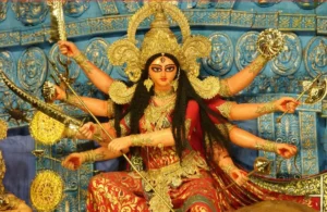 Goddess Durga with ten arms holding divine weapons and blessing devotees