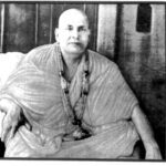 Swami Sivananda seated peacefully in meditation image