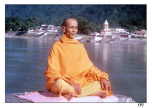 Swami Sivananda meditating peacefully on the banks of the Ganga