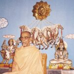 Swami Krishnananda Saraswati delivering New Year spiritual blessings before sacred deities peacefully