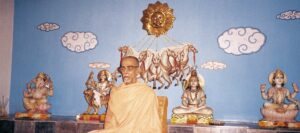 Swami Krishnananda Saraswati delivering New Year spiritual blessings before sacred deities peacefully