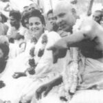 Swami Sivananda with devotees during spiritual discourse