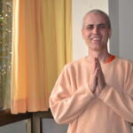 Swami Sivadasananda greeting with folded hands
