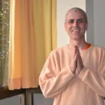 Swami Sivadasananda greeting with folded hands