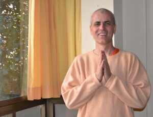 Swami Sivadasananda greeting with folded hands